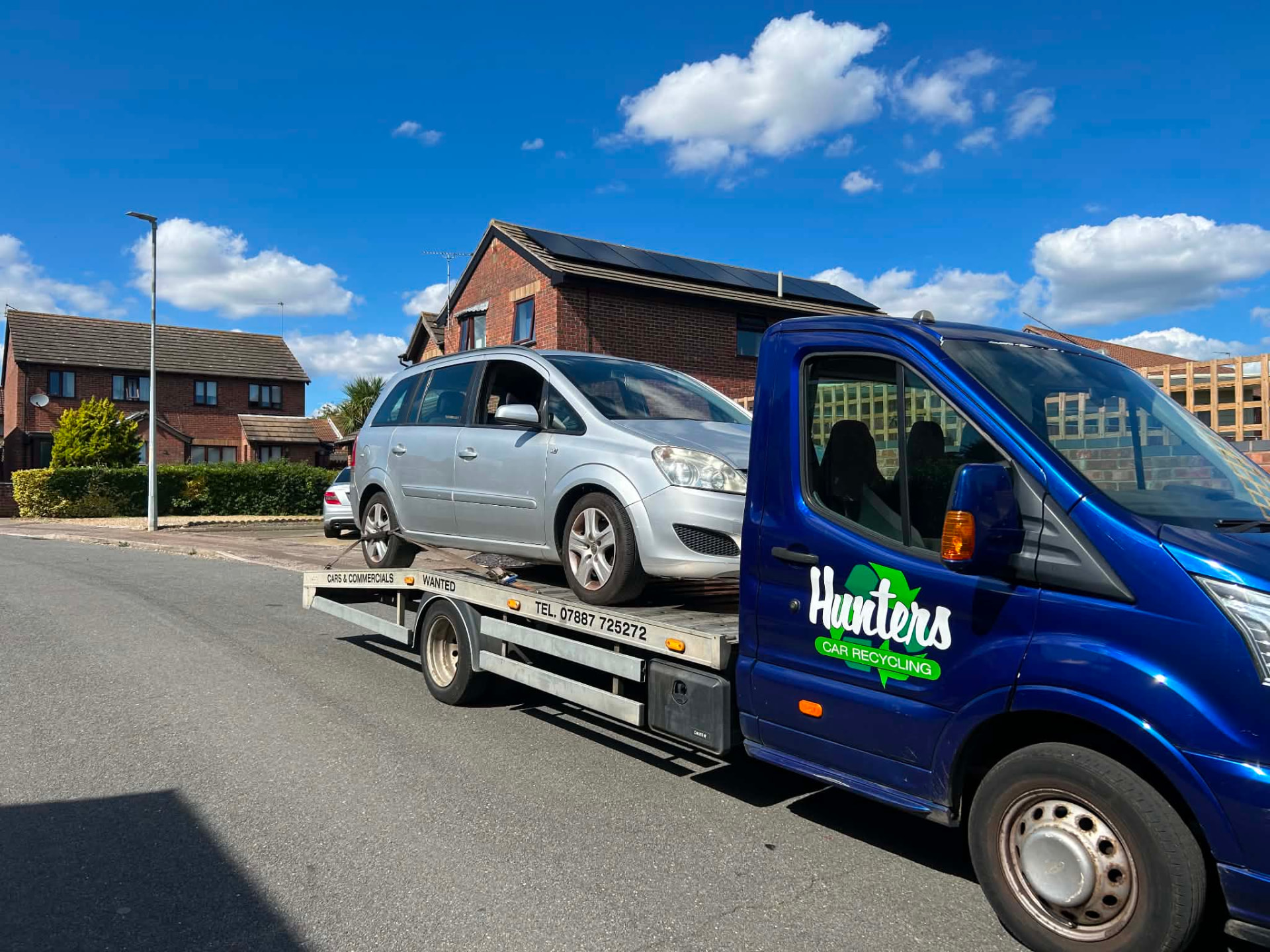 Hunters Vehicle Recycling recovery truck collecting a scrap car